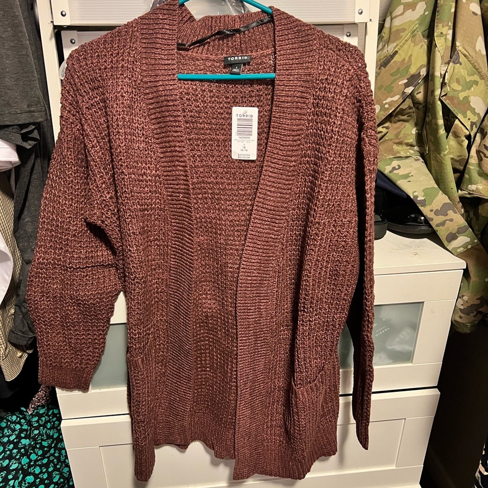 Brown sweater.